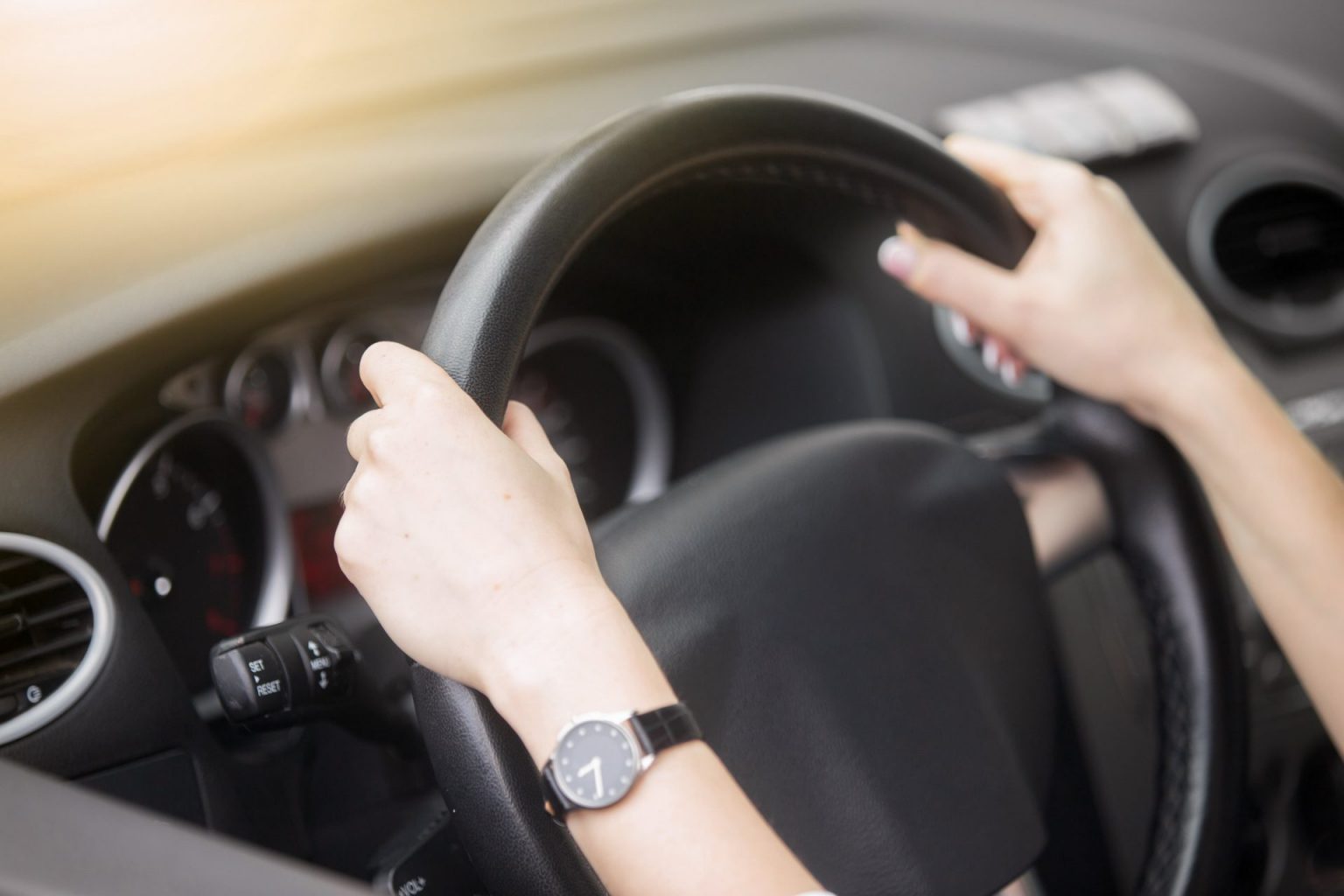 portrait-attractive-smiling-woman-driving-car-min